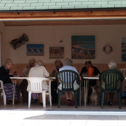 Residents in log cabin