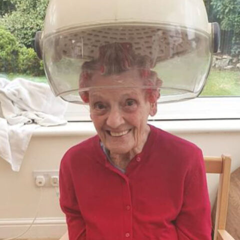 Resident having hair cut