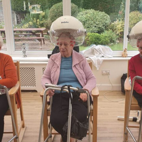 Residents having hair cut